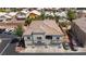 Contemporary two-story condo with tile roof, attached garages, and neutral paint at 6170 E Sahara Ave # 1076, Las Vegas, NV 89142