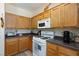 Functional kitchen featuring ample counter space, a microwave, and a gas range at 6170 E Sahara Ave # 1076, Las Vegas, NV 89142