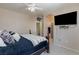 Bright main bedroom featuring a ceiling fan, a flat screen television, and a neutral color palette at 6170 E Sahara Ave # 1076, Las Vegas, NV 89142