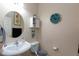 Cozy powder room with stylish fixtures, neutral tones, and decorative accents at 6170 E Sahara Ave # 1076, Las Vegas, NV 89142