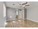 Bedroom with laminate flooring, ceiling fan, and natural light from large window at 6953 Graceful Cloud, Henderson, NV 89011