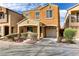 Two-story home with desert landscaping and an attached garage at 6953 Graceful Cloud, Henderson, NV 89011