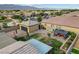Expansive aerial view of a landscaped backyard including pool, water feature, gazebo, and detached garage at 7036 Winstar St, Las Vegas, NV 89131