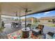 Spacious backyard with a covered patio, fire pit, and comfortable seating, perfect for outdoor entertaining at 7036 Winstar St, Las Vegas, NV 89131