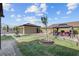 Well-manicured backyard with a detached garage, gazebo, a water feature, and lush green grass at 7036 Winstar St, Las Vegas, NV 89131