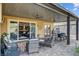 Inviting backyard patio with ample seating, a stylish rug, and easy access to indoor living spaces at 7036 Winstar St, Las Vegas, NV 89131