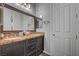 Bathroom features a double sink with marble countertops and large framed mirror at 7036 Winstar St, Las Vegas, NV 89131