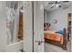 Bathroom features glass doors for shower and access to bedroom at 7036 Winstar St, Las Vegas, NV 89131