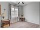 Empty bedroom with two side tables and large windows with elegant curtains at 7036 Winstar St, Las Vegas, NV 89131