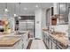 Modern kitchen boasts granite countertops, stainless appliances, and an island with a butcher block countertop at 7036 Winstar St, Las Vegas, NV 89131