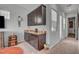 Open floor plan kitchenette with dark cabinets, granite countertops, and bright windows at 7036 Winstar St, Las Vegas, NV 89131