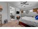 Comfortable main bedroom with a ceiling fan, carpeted floors, and an ensuite bathroom at 7036 Winstar St, Las Vegas, NV 89131