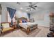 Cozy main bedroom with a ceiling fan and comfortable furnishings at 7036 Winstar St, Las Vegas, NV 89131
