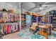 Well-organized walk-in closet with custom shelving, hanging rods, and a seating area at 7036 Winstar St, Las Vegas, NV 89131