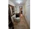 View of tiled bathroom with toilet, sink, and vanity; with an open doorway leading to a closet at 7108 Moon Ct, Las Vegas, NV 89145
