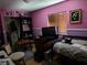 A bedroom featuring a bed, television, and miscellaneous furniture at 7108 Moon Ct, Las Vegas, NV 89145