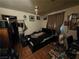 This is a bedroom with tile flooring, dark walls, and a ceiling fan at 7108 Moon Ct, Las Vegas, NV 89145