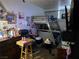 Small bedroom with a bunk bed, dresser, and various personal items at 7108 Moon Ct, Las Vegas, NV 89145