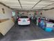 Spacious garage with overhead lighting and storage containing a car and miscellaneous items at 7108 Moon Ct, Las Vegas, NV 89145