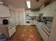 Well-maintained kitchen featuring plenty of cabinet space and tile flooring at 7108 Moon Ct, Las Vegas, NV 89145