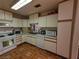 Well-lit kitchen with white cabinets, and laminate countertops at 7108 Moon Ct, Las Vegas, NV 89145