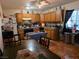 Cozy kitchen features wooden cabinetry, tile floors, and dining table at 7108 Moon Ct, Las Vegas, NV 89145