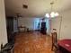 Open-concept living room with tile flooring, ceiling fan, and natural light at 7108 Moon Ct, Las Vegas, NV 89145