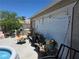 Patio area featuring decorations, chairs, plants, and a pool at 7108 Moon Ct, Las Vegas, NV 89145