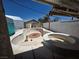 Backyard pool with a spa, surrounded by a concrete patio and white walls at 7108 Moon Ct, Las Vegas, NV 89145