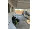 Covered back patio with a concrete surface and fenced perimeter, providing a partially shaded outdoor space at 712 Donner St, Las Vegas, NV 89107