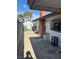 View of a paved backyard space featuring a colorful mural and brick accents at 712 Donner St, Las Vegas, NV 89107