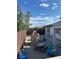 Backyard featuring play equipment, outdoor furniture, and a gravel ground cover at 712 Donner St, Las Vegas, NV 89107