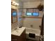 Bathroom with a combined bathtub and shower, featuring a neutral-toned curtain and wall decor at 712 Donner St, Las Vegas, NV 89107