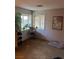 Bedroom with large windows providing lots of natural light, adorned with various potted plants at 712 Donner St, Las Vegas, NV 89107