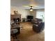 Open living room area with comfortable seating and a brick fireplace at 712 Donner St, Las Vegas, NV 89107