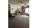 Large playroom area with colorful décor, carpeted flooring, and ceiling fan at 712 Donner St, Las Vegas, NV 89107