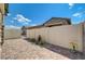 Paver stone backyard featuring manicured landscaping, bird bath, and gated access on a sunny day at 794 Sunny Sagebrush St, Henderson, NV 89011