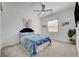 Cozy bedroom featuring neutral decor and a ceiling fan, and light carpet at 794 Sunny Sagebrush St, Henderson, NV 89011