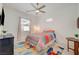The bedroom offers a ceiling fan and plenty of natural light, creating a relaxing retreat at 794 Sunny Sagebrush St, Henderson, NV 89011