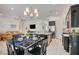 Modern kitchen and dining area create an inviting space for entertaining with seamless transition to the living area at 794 Sunny Sagebrush St, Henderson, NV 89011