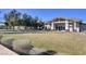 Community clubhouse with a well-manicured lawn and attractive desert landscaping featuring outdoor seating at 794 Sunny Sagebrush St, Henderson, NV 89011