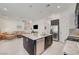 Open floor plan combines the kitchen and living area, offering seamless entertaining and tile floors at 794 Sunny Sagebrush St, Henderson, NV 89011
