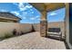 Paver patio featuring a bench, stone pillars and partial covering perfect for outdoor living and relaxing at 794 Sunny Sagebrush St, Henderson, NV 89011