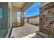Paver patio with privacy fence, stone pillars and some landscaping, ideal for relaxing outdoors at 794 Sunny Sagebrush St, Henderson, NV 89011