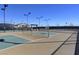 Outdoor pickleball courts with professional surfacing, lighting, and seating for players and spectators at 794 Sunny Sagebrush St, Henderson, NV 89011