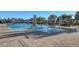 Resort-style pool with lounge chairs, umbrellas, and lush landscaping for a relaxing outdoor experience at 794 Sunny Sagebrush St, Henderson, NV 89011