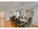 Inviting dining room features a table for eight, modern light fixtures, and stylish decor at 8021 Hilliard Ave, Las Vegas, NV 89128