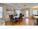 Elegant dining room features a long table, stylish chairs, and a fireplace in the background at 8021 Hilliard Ave, Las Vegas, NV 89128