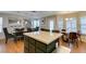 Open kitchen with large island, stainless appliances, and adjacent dining area at 8021 Hilliard Ave, Las Vegas, NV 89128