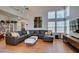 Bright living room boasts soaring ceilings, large windows, and a comfortable sectional sofa at 8021 Hilliard Ave, Las Vegas, NV 89128